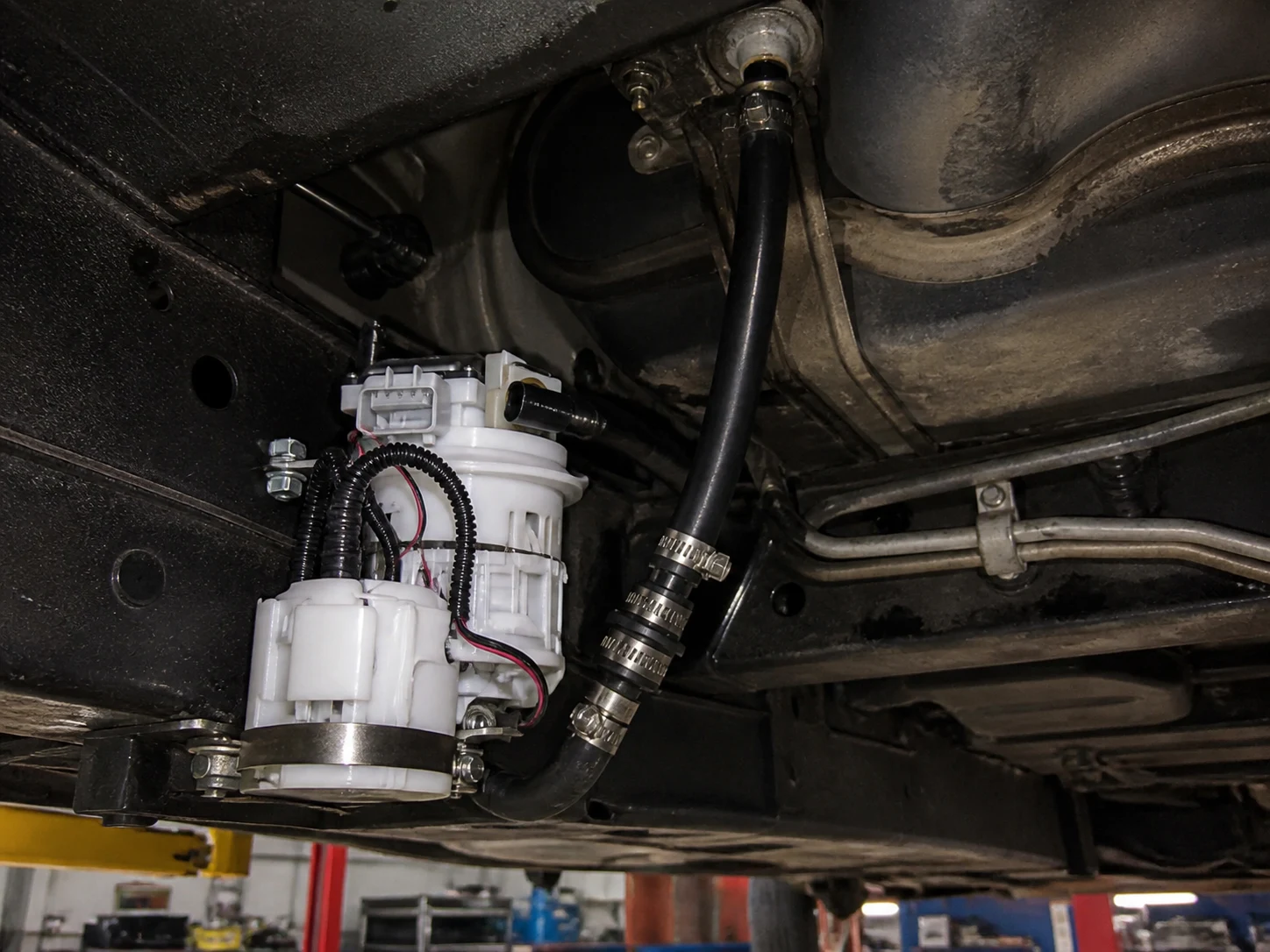 External Fuel Pump Vs Internal: Comparison Guide External inline electric fuel pump mounted low near the tank