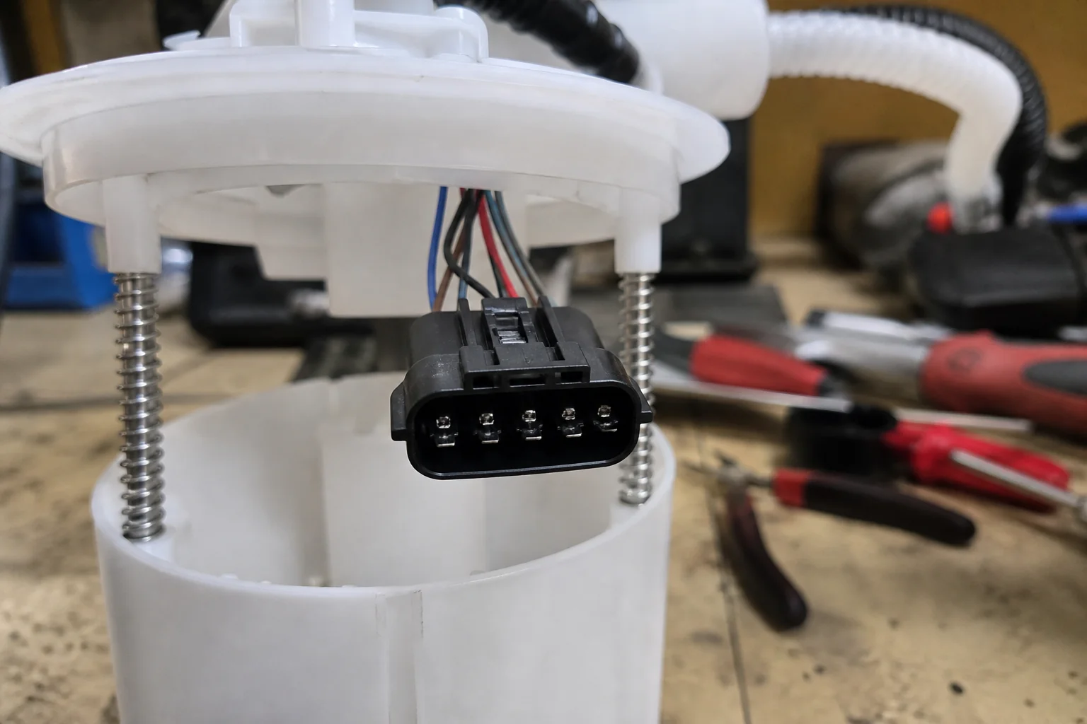 Close-up of an in-tank fuel pump module electrical connector pin cavities