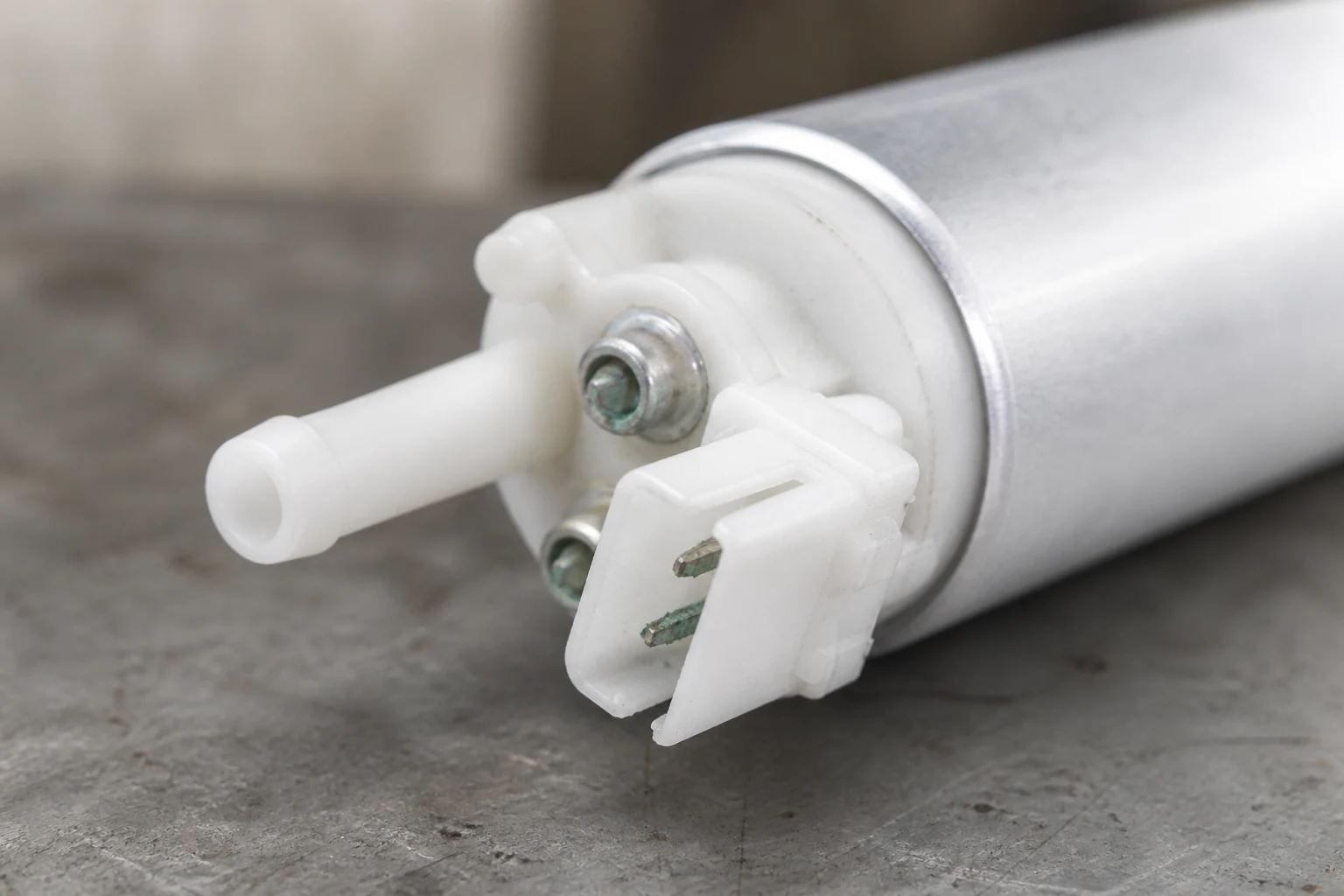 Macro view of corroded terminal pins inside a fuel pump electrical connector